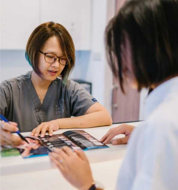 Receptionist planning next patient's meeting.